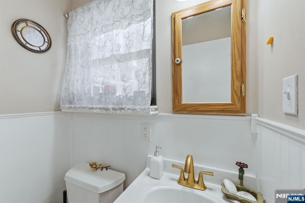 587 Marlboro Road Old Bridge, NJ 08857 - Photo 21 of 36 a bathroom with a sink and a mirror