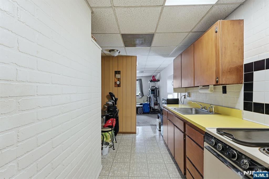 587 Marlboro Road Old Bridge, NJ 08857 - Photo 23 of 36 a kitchen with a sink and cabinets