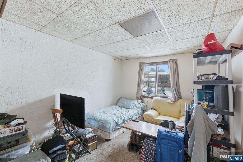 587 Marlboro Road Old Bridge, NJ 08857 - Photo 25 of 36 a living room with furniture a flat screen tv and a fireplace