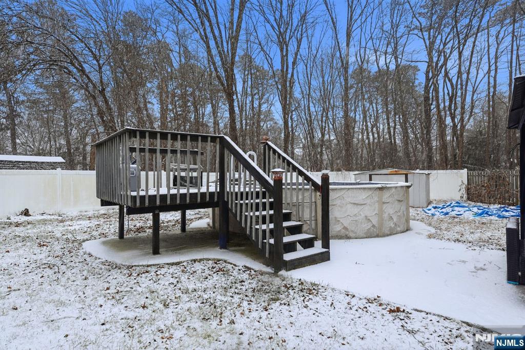 587 Marlboro Road Old Bridge, NJ 08857 - Photo 30 of 36 a view of a chairs setting on the deck in front of the house