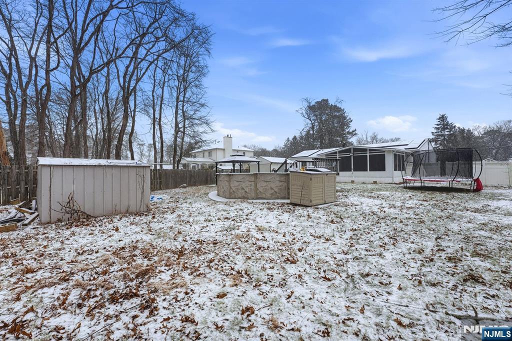 587 Marlboro Road Old Bridge, NJ 08857 - Photo 34 of 36 a backyard of a house with oven and wooden fence