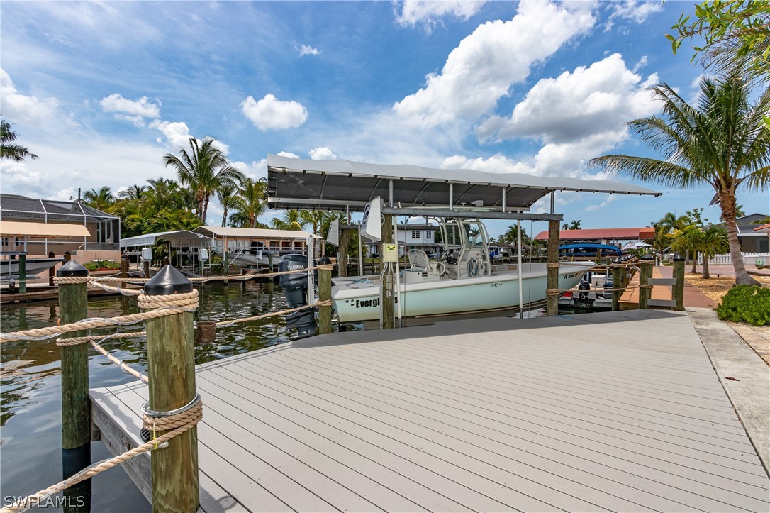 2743 Janet Street Cape Coral, FL 33993 - Photo 28 of 35 a view of a chairs and table in the patio