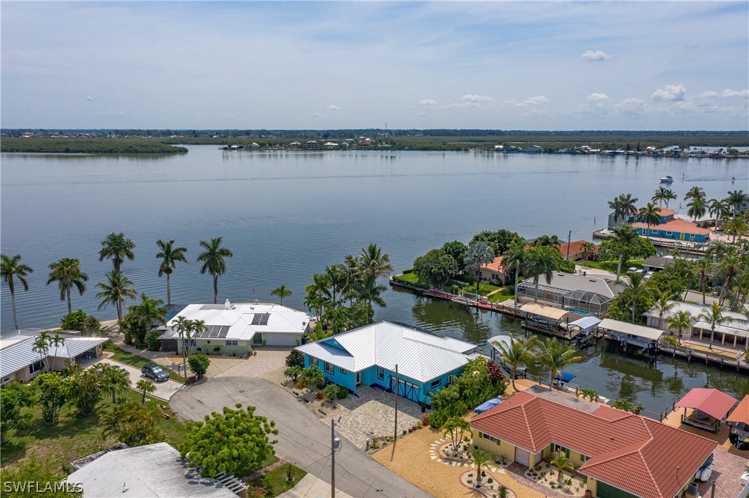 2743 Janet Street Cape Coral, FL 33993 - Photo 7 of 35 a view of a lake with couches and city view
