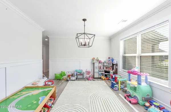 a bedroom with bed and a window