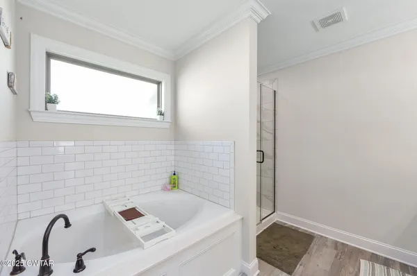 a bathroom with a sink and a window