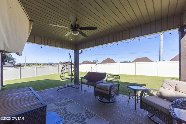 a patio with table and chairs