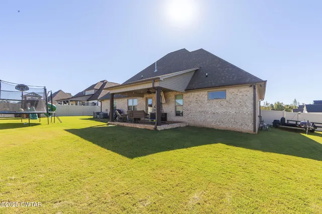 a view of a swimming pool with garden