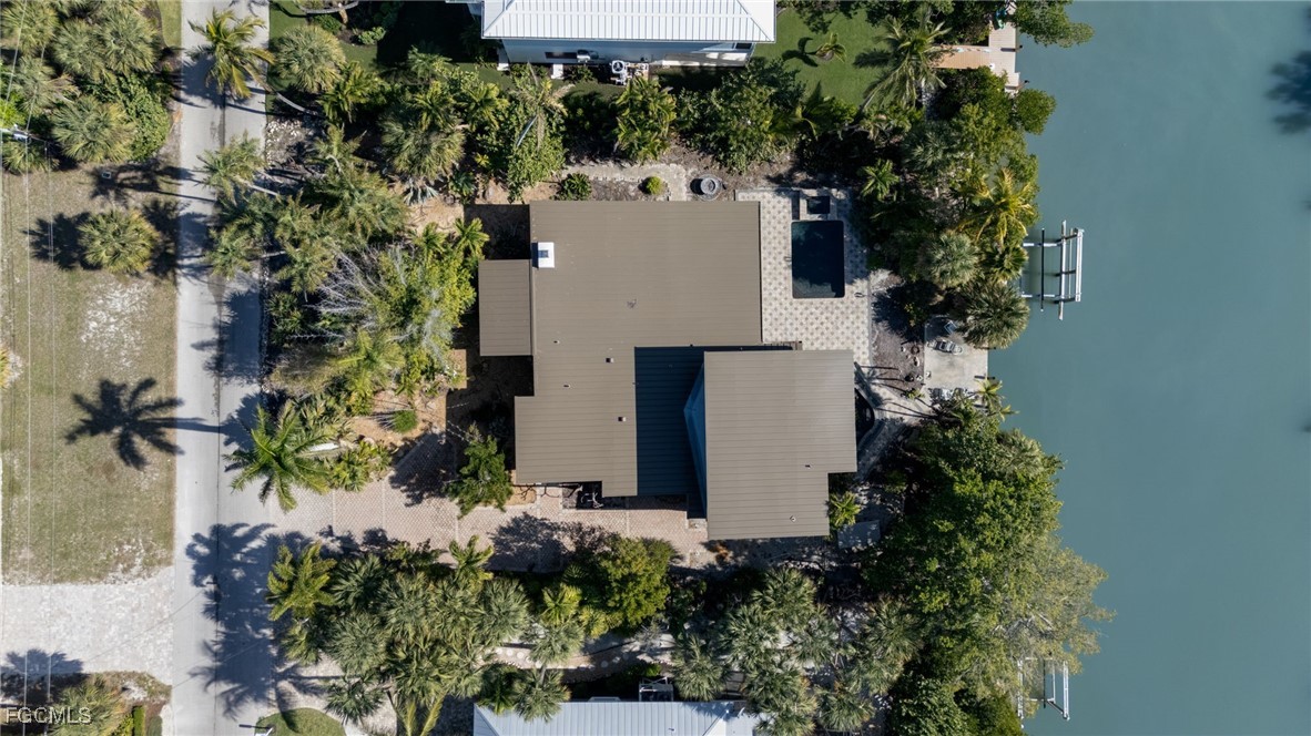 505 Lighthouse Way Sanibel, FL 33957 - Photo 8 of 11 an aerial view of a house with a yard and garden