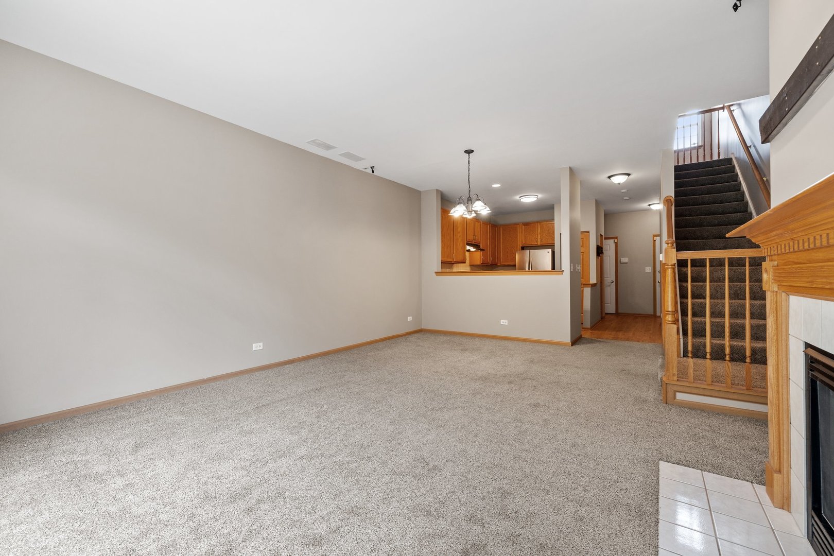 2442 Oneida Lane Naperville, IL 60563 - Photo 11 of 23 an empty room with a kitchen and entryway