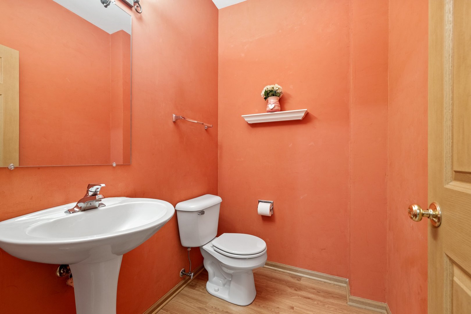 2442 Oneida Lane Naperville, IL 60563 - Photo 12 of 23 a bathroom with a sink a toilet and a mirror