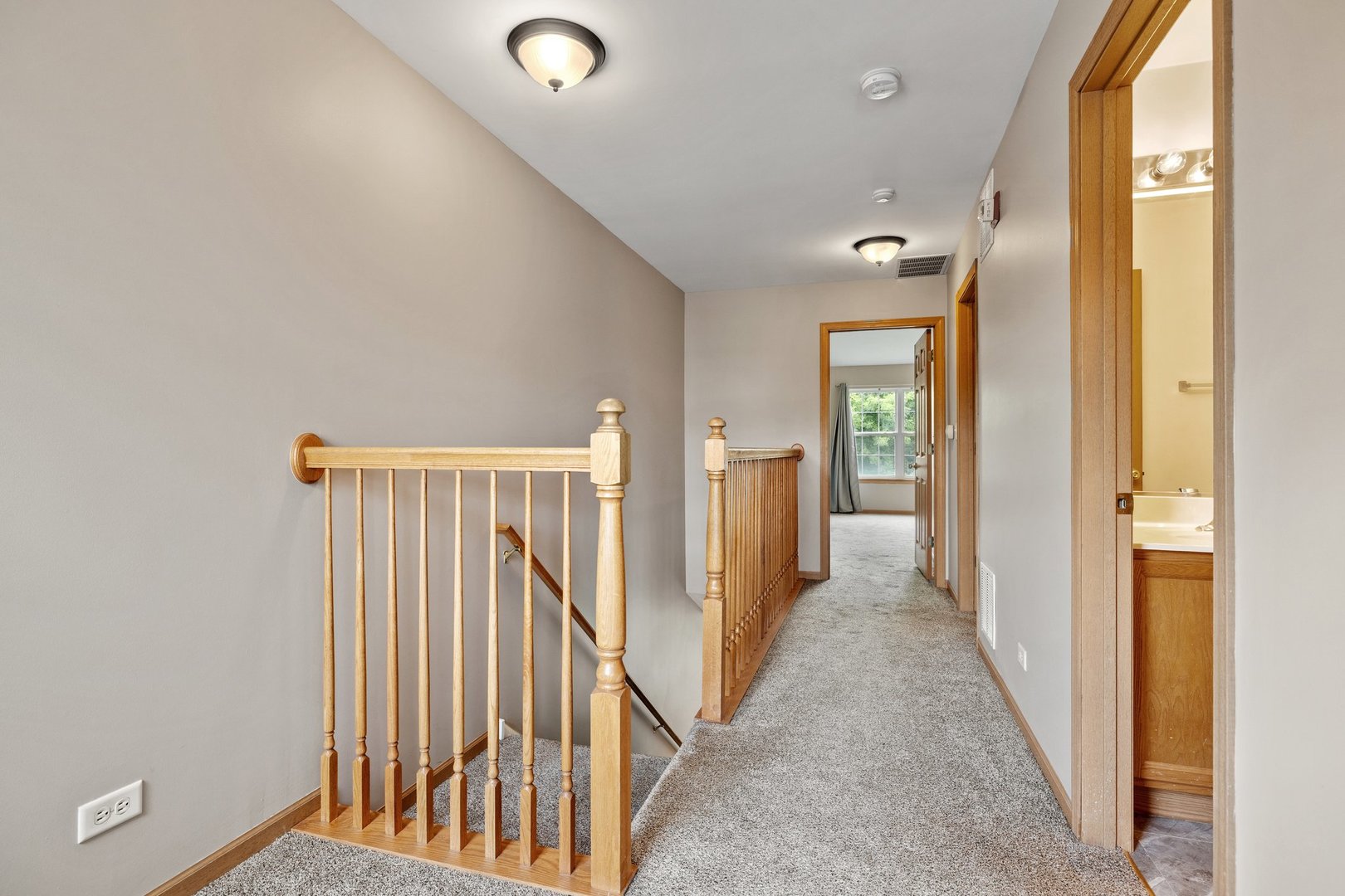 2442 Oneida Lane Naperville, IL 60563 - Photo 13 of 23 a view of a hallway with wooden floor and entryway