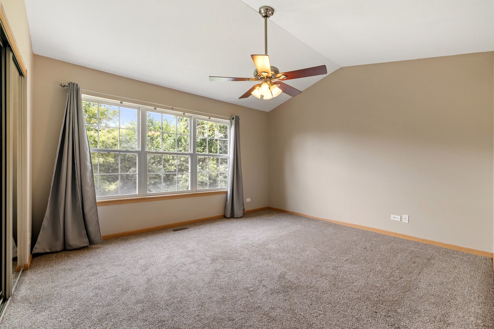 2442 Oneida Lane Naperville, IL 60563 - Photo 14 of 23 a view of a livingroom with a ceiling fan and window