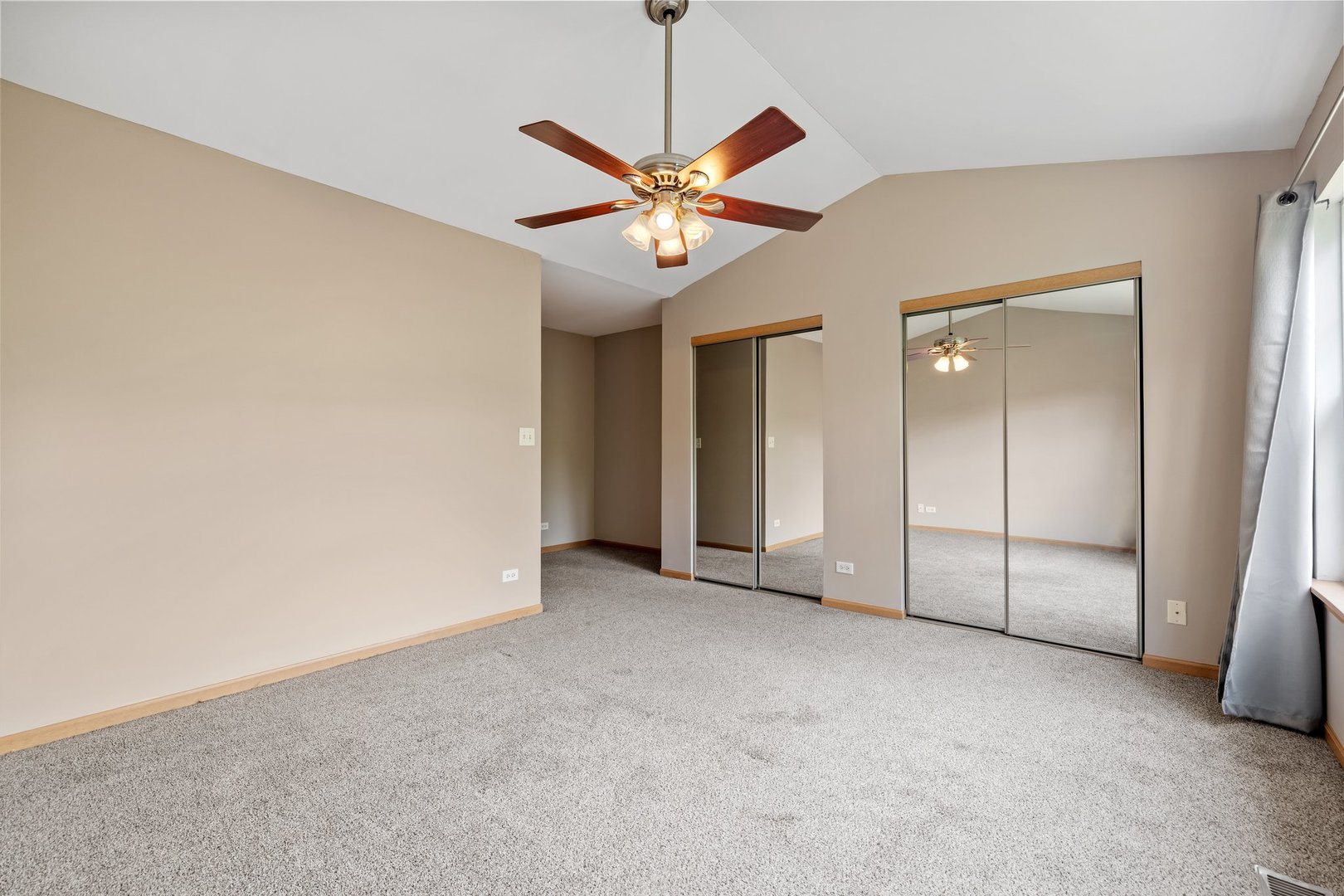 2442 Oneida Lane Naperville, IL 60563 - Photo 15 of 23 a view of an empty room with a ceiling fan