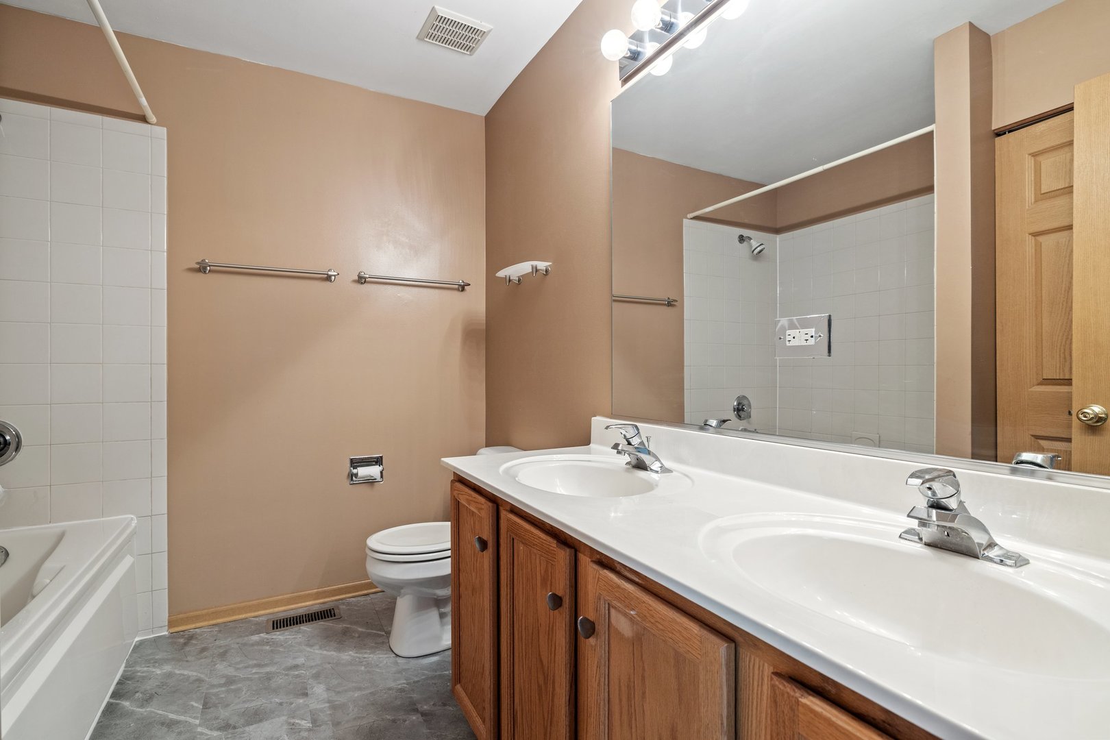 2442 Oneida Lane Naperville, IL 60563 - Photo 16 of 23 a bathroom with a sink a toilet and shower