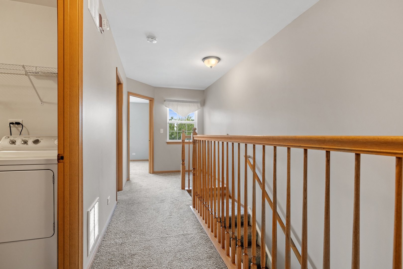 2442 Oneida Lane Naperville, IL 60563 - Photo 17 of 23 a view of a hallway with a white walls