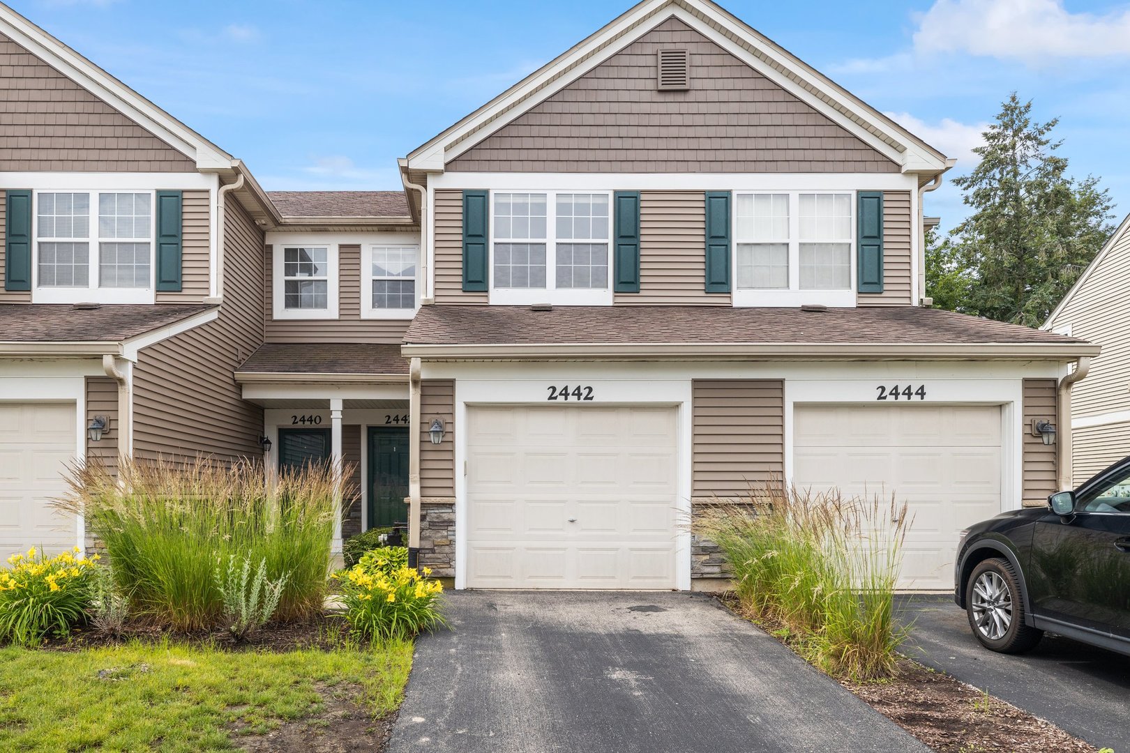 2442 Oneida Lane Naperville, IL 60563 - Photo 2 of 23 a view of a house with a yard and plants