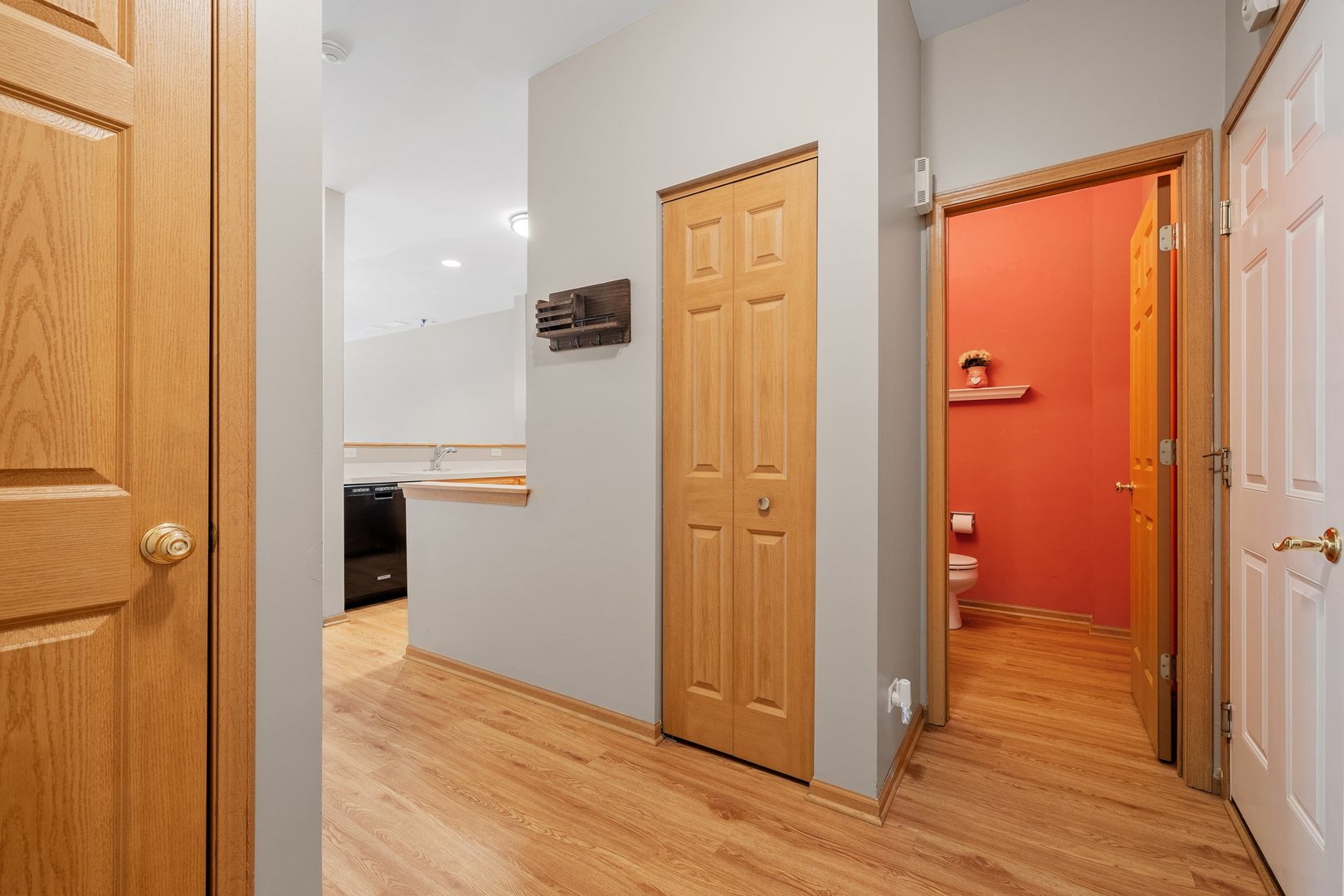 2442 Oneida Lane Naperville, IL 60563 - Photo 4 of 23 a view of a hallway with wooden floor and closet area