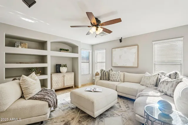 a living room with furniture and a large window
