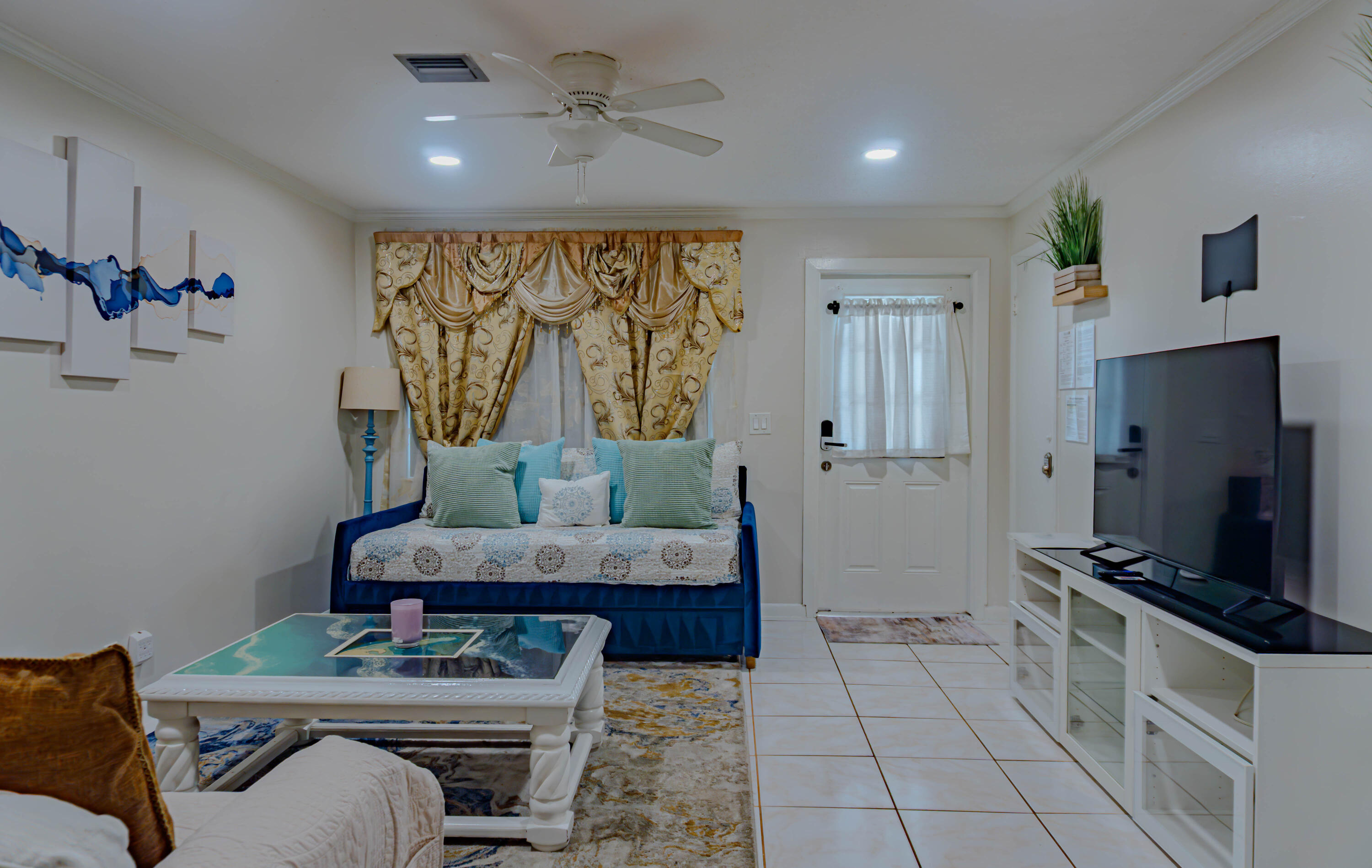 1230 Block Island Road, Unit 1 Wellington, FL 33414 - Photo 3 of 17 a living room with furniture and a flat screen tv