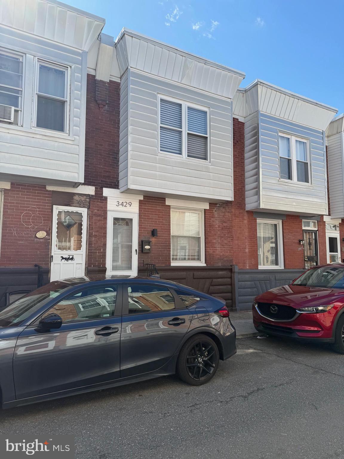 a car parked in front of a house
