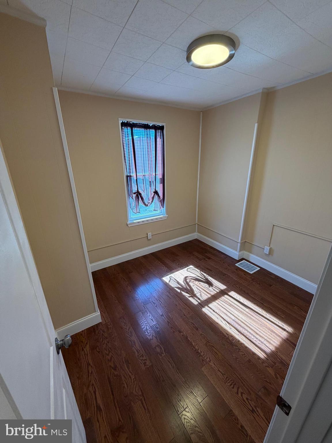 3429 Tilton Street Philadelphia, PA 19134 - Photo 14 of 23 a view of a room with wooden floor and window