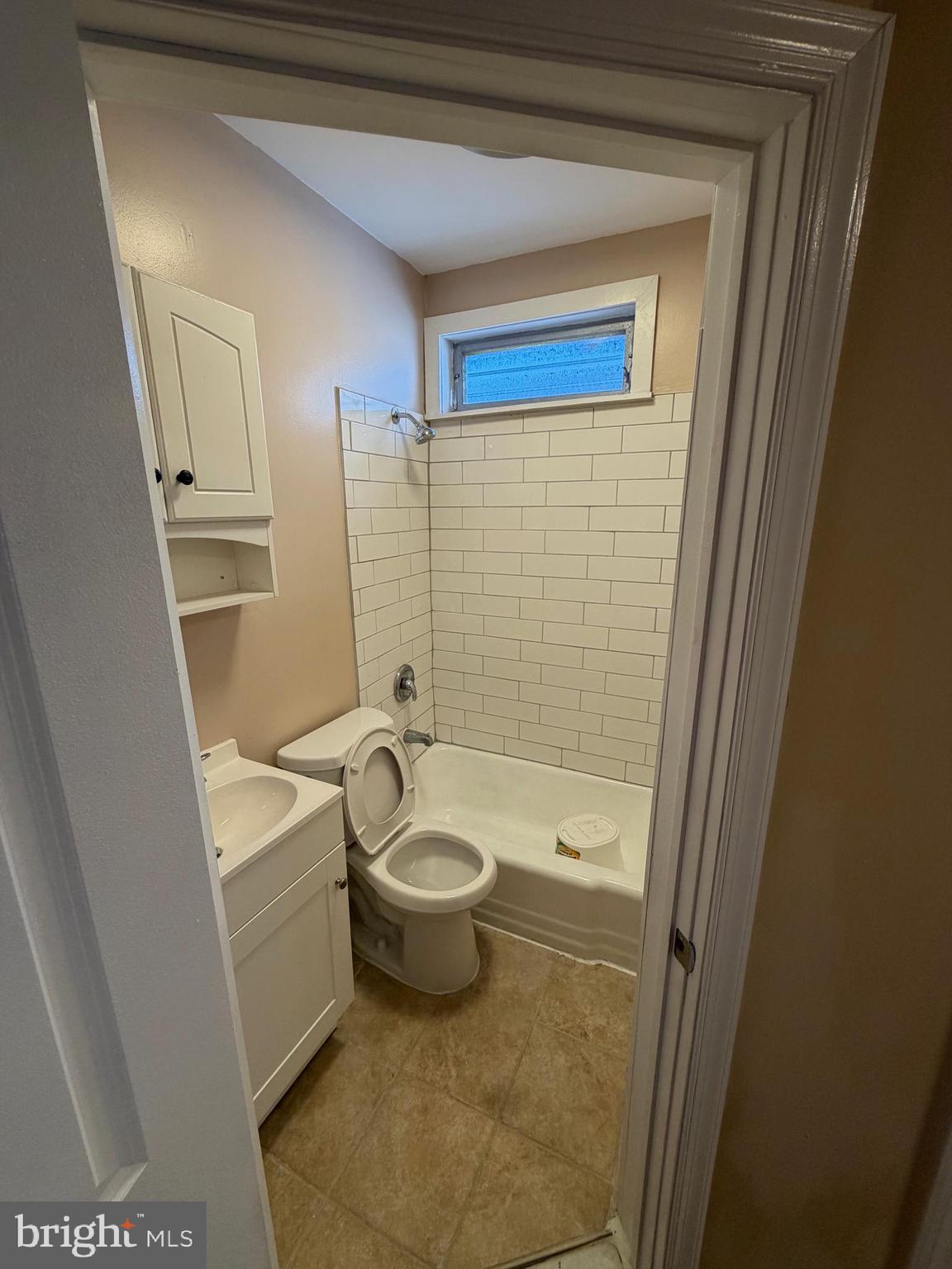 3429 Tilton Street Philadelphia, PA 19134 - Photo 16 of 23 a bathroom with a toilet a sink and bathtub