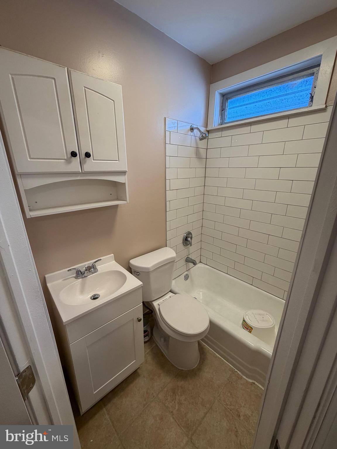 3429 Tilton Street Philadelphia, PA 19134 - Photo 17 of 23 a bathroom with a sink a toilet and shower
