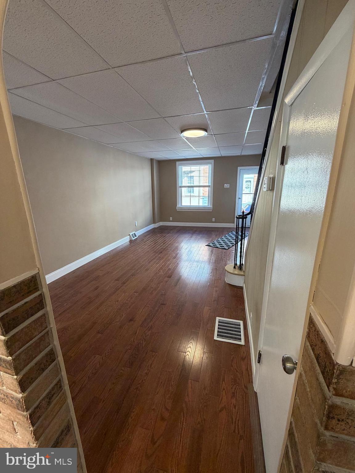 3429 Tilton Street Philadelphia, PA 19134 - Photo 5 of 23 a view of a livingroom with wooden floor and staircase