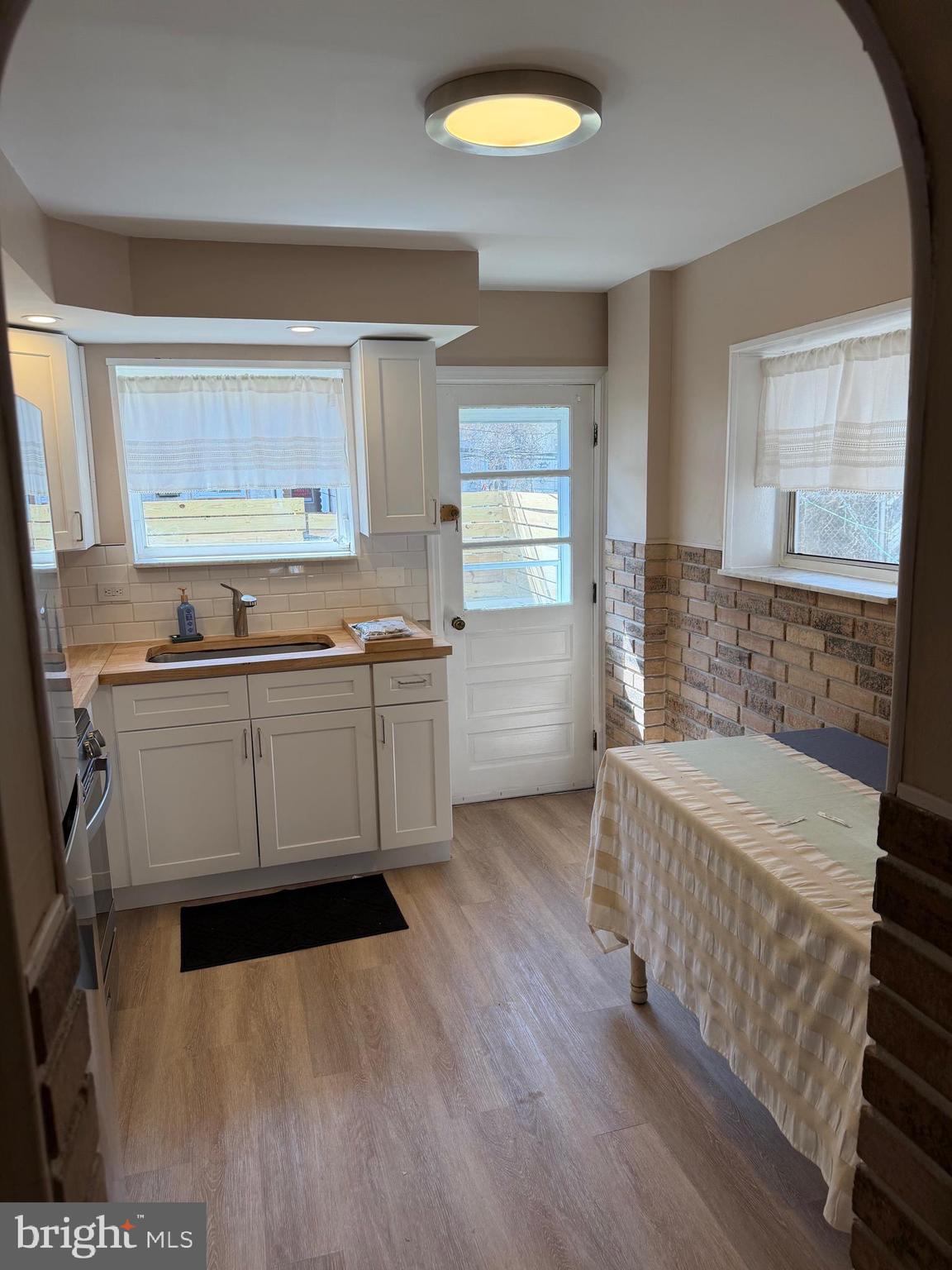 3429 Tilton Street Philadelphia, PA 19134 - Photo 7 of 23 a kitchen with a sink and a stove top oven