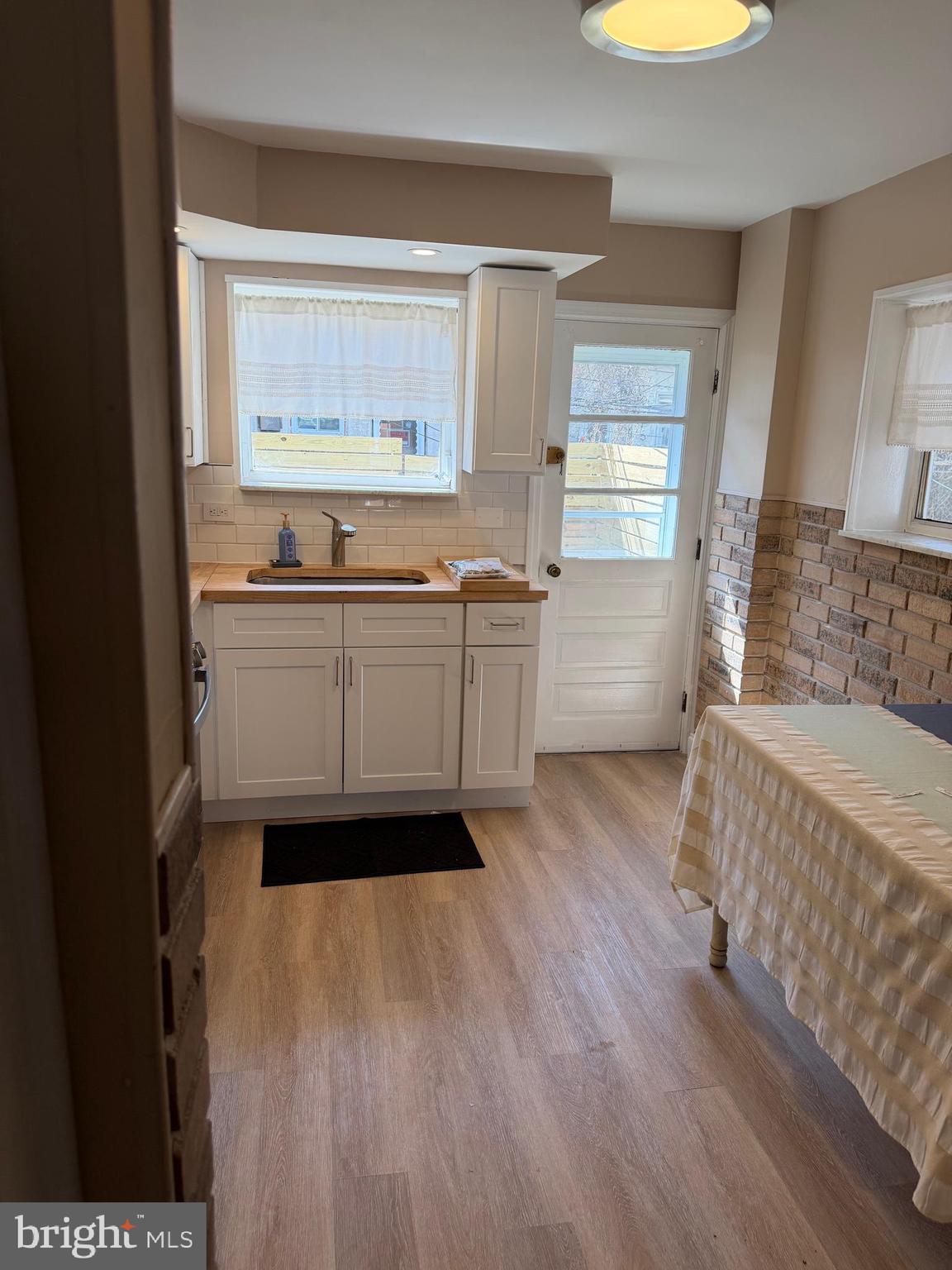3429 Tilton Street Philadelphia, PA 19134 - Photo 9 of 23 a kitchen with a sink and wooden floor