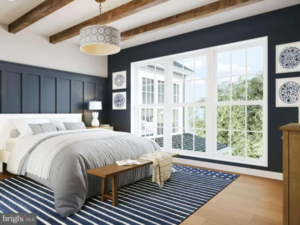 a bedroom with a large bed and a large window