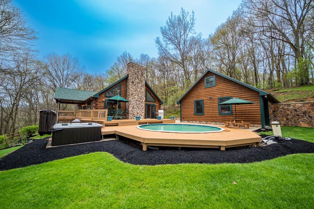 155 Glade Run Road Mars, PA 16046 - Photo 1 of 25 a view of house with backyard and seating area