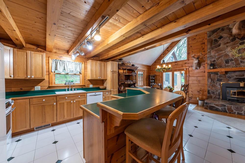 155 Glade Run Road Mars, PA 16046 - Photo 13 of 25 a kitchen with a table chairs sink and cabinets