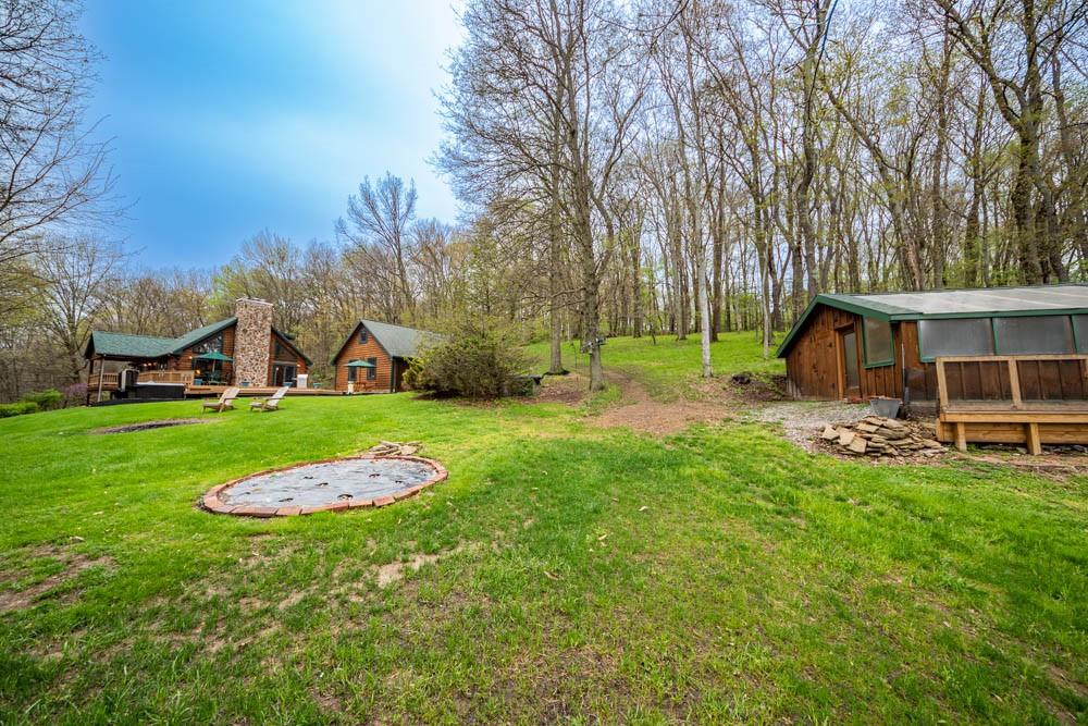 155 Glade Run Road Mars, PA 16046 - Photo 23 of 25 a view of a backyard with table and chairs and wooden fence