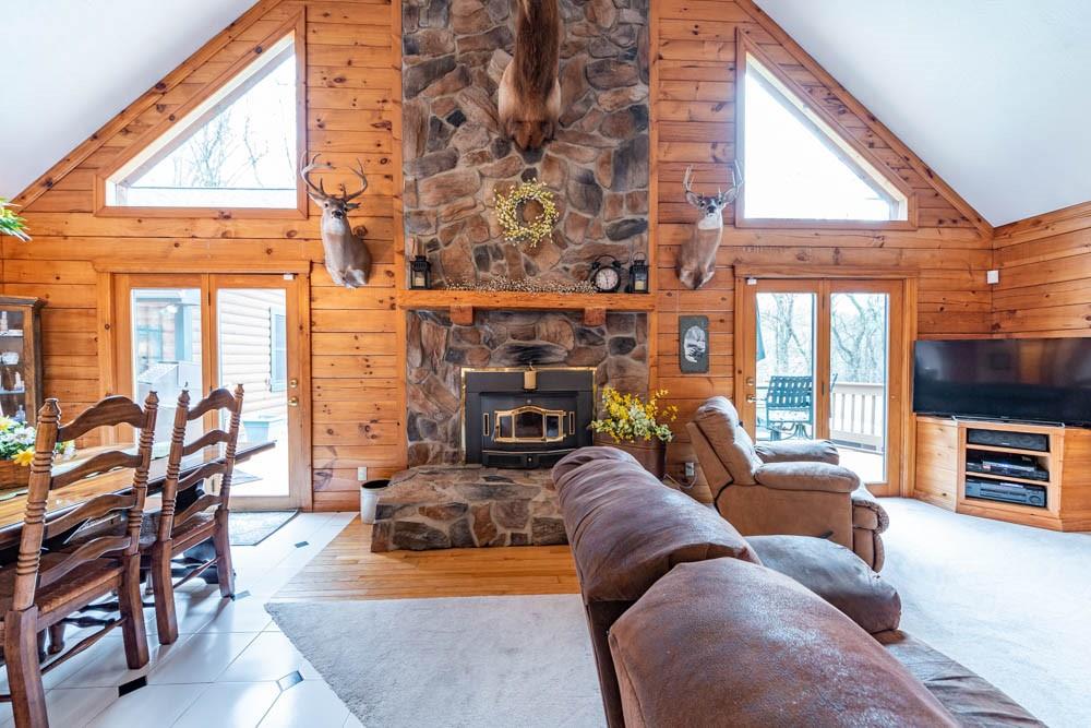 155 Glade Run Road Mars, PA 16046 - Photo 10 of 25 a living room with furniture a flat screen tv and a floor to ceiling window