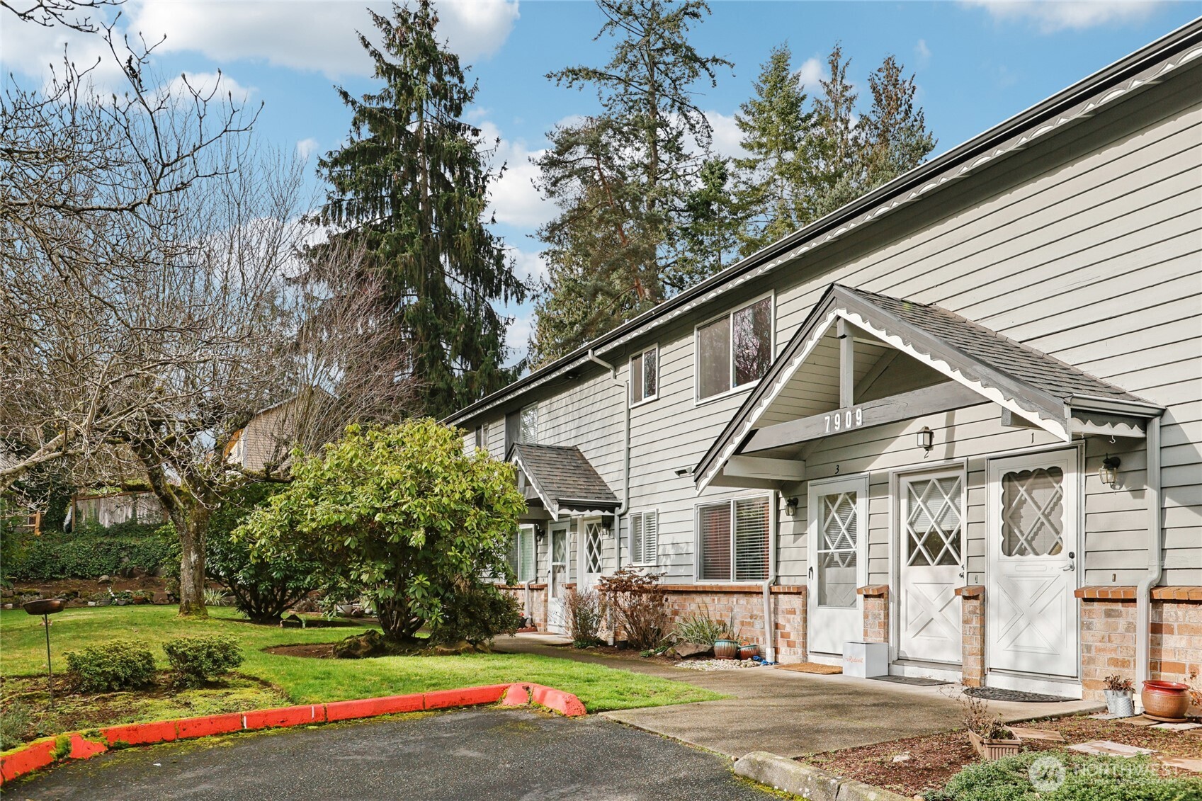 7909 218th Street Southwest, Unit 4 Edmonds, WA 98026 - Photo 3 of 29 a view of a house with a yard