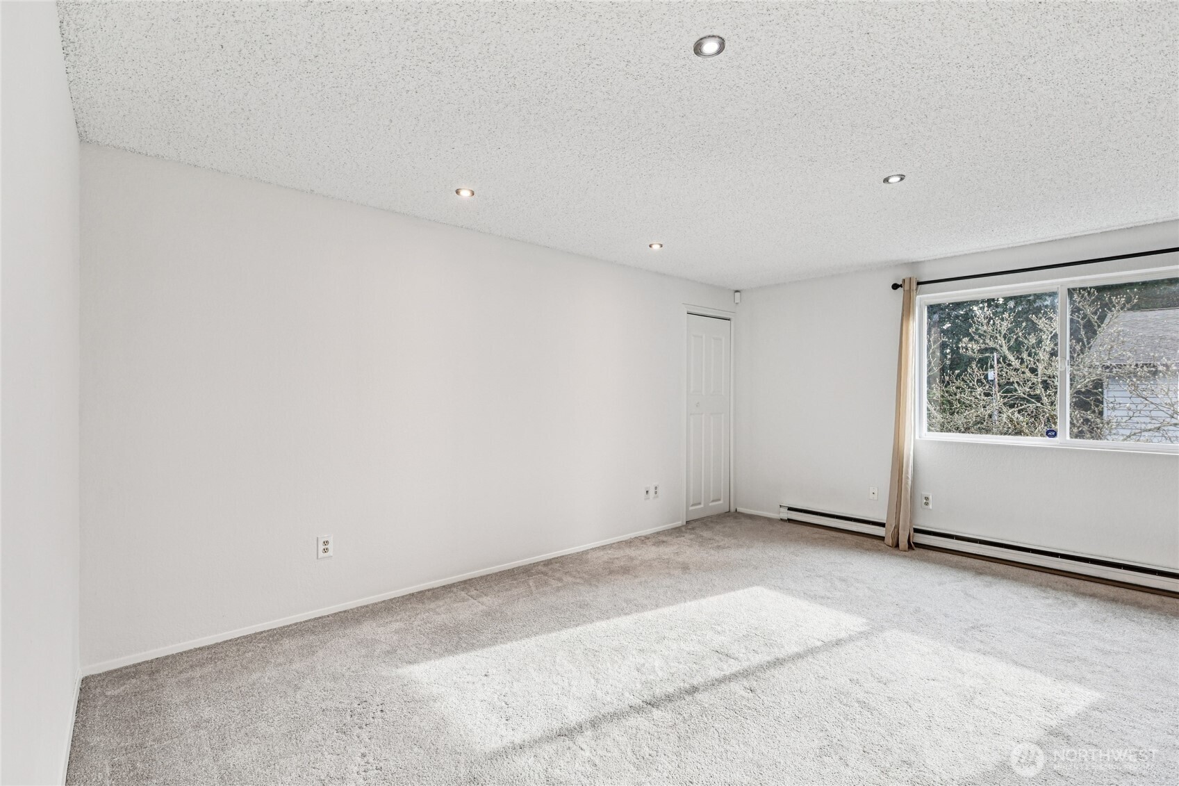 7909 218th Street Southwest, Unit 4 Edmonds, WA 98026 - Photo 8 of 29 a view of an empty room with a window