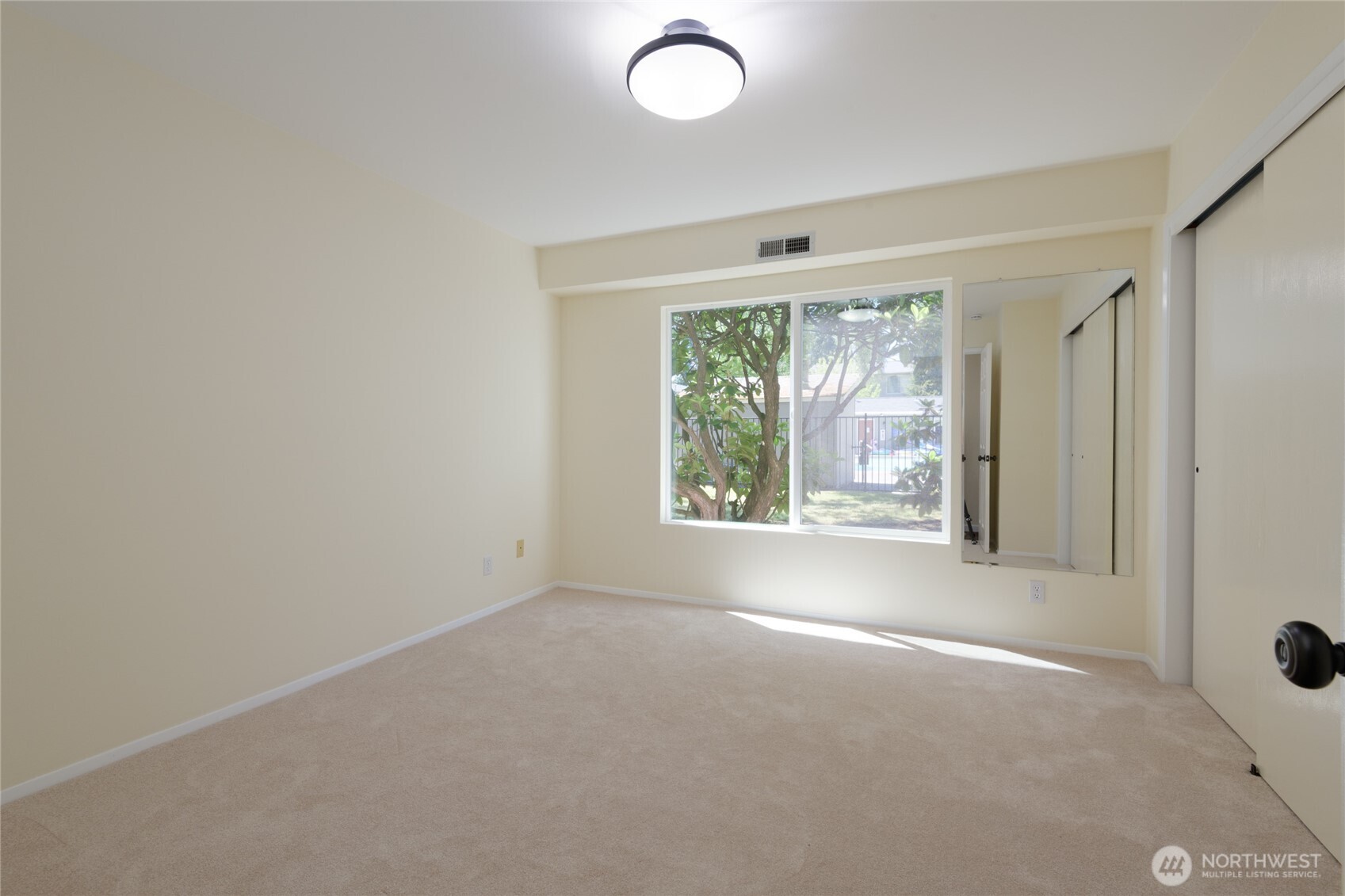5029 84th Street Southwest Mukilteo, WA 98275 - Photo 13 of 16 a view of a room that has a window in it