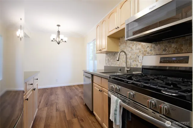 a kitchen with a stove and a microwave