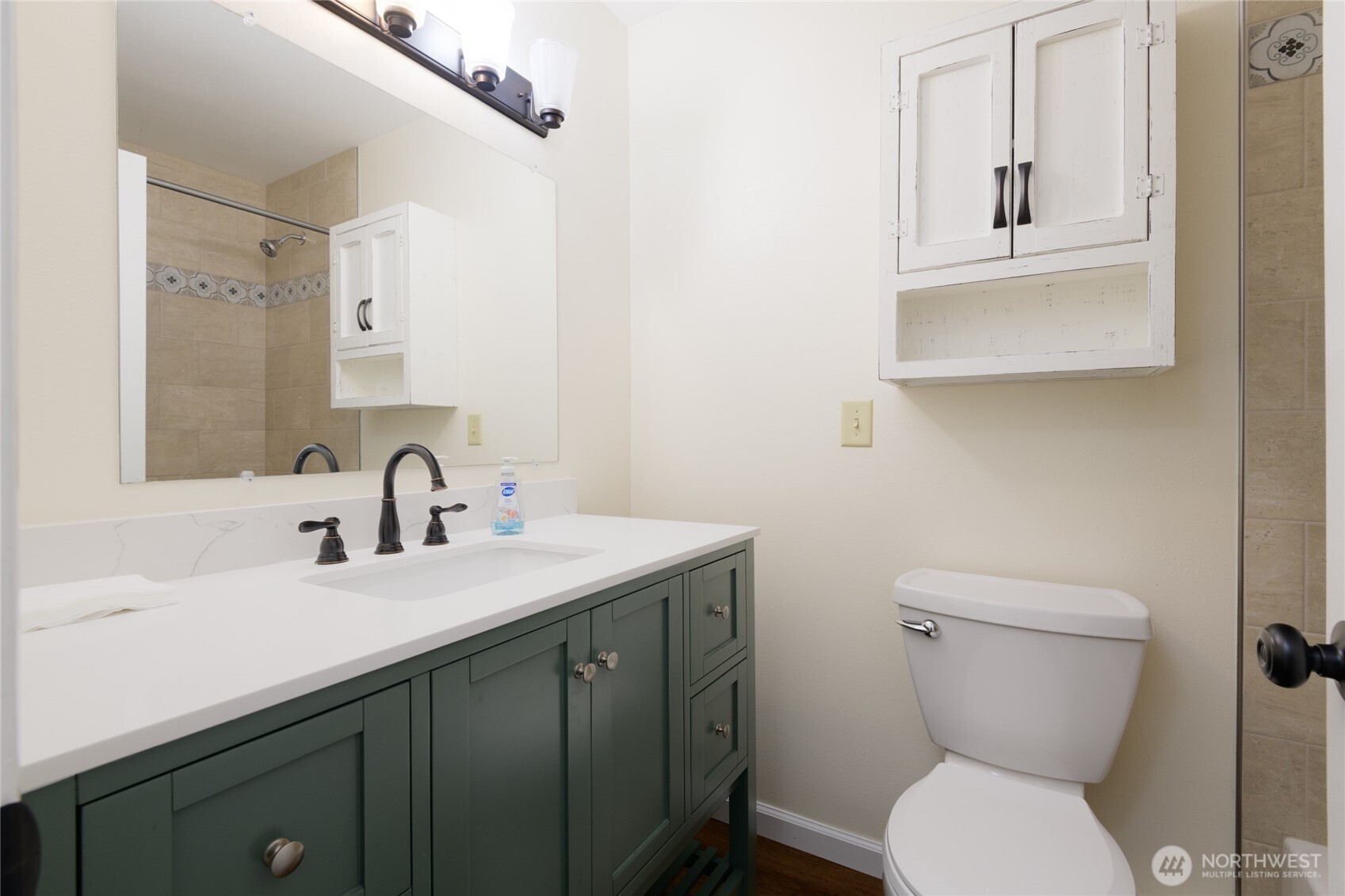 5029 84th Street Southwest Mukilteo, WA 98275 - Photo 15 of 16 a bathroom with a toilet sink and mirror