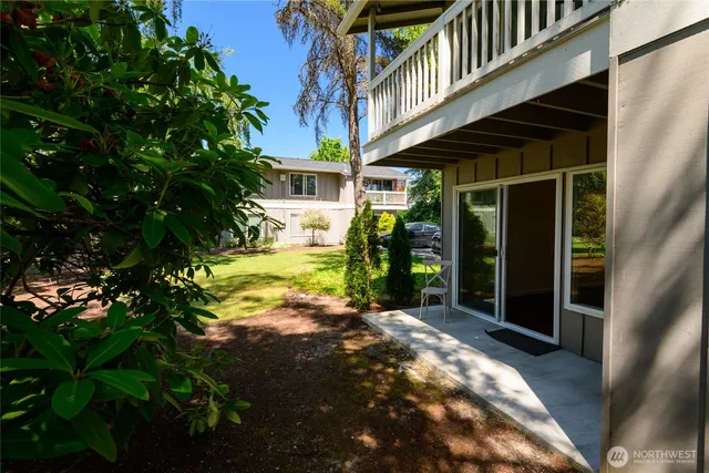 a view of a backyard of the house