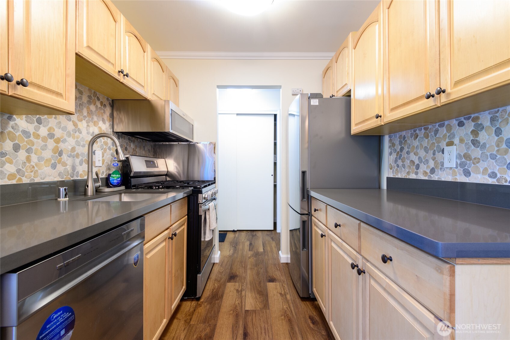 5029 84th Street Southwest Mukilteo, WA 98275 - Photo 10 of 16 a kitchen with granite countertop a sink a stove and refrigerator