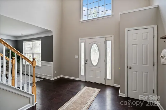 a view of an entryway with wooden floor