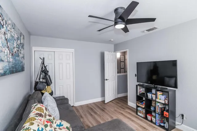 a bed room with a bed and a tv