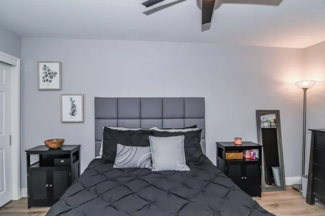 a bathroom with a sink mirror toilet and shower