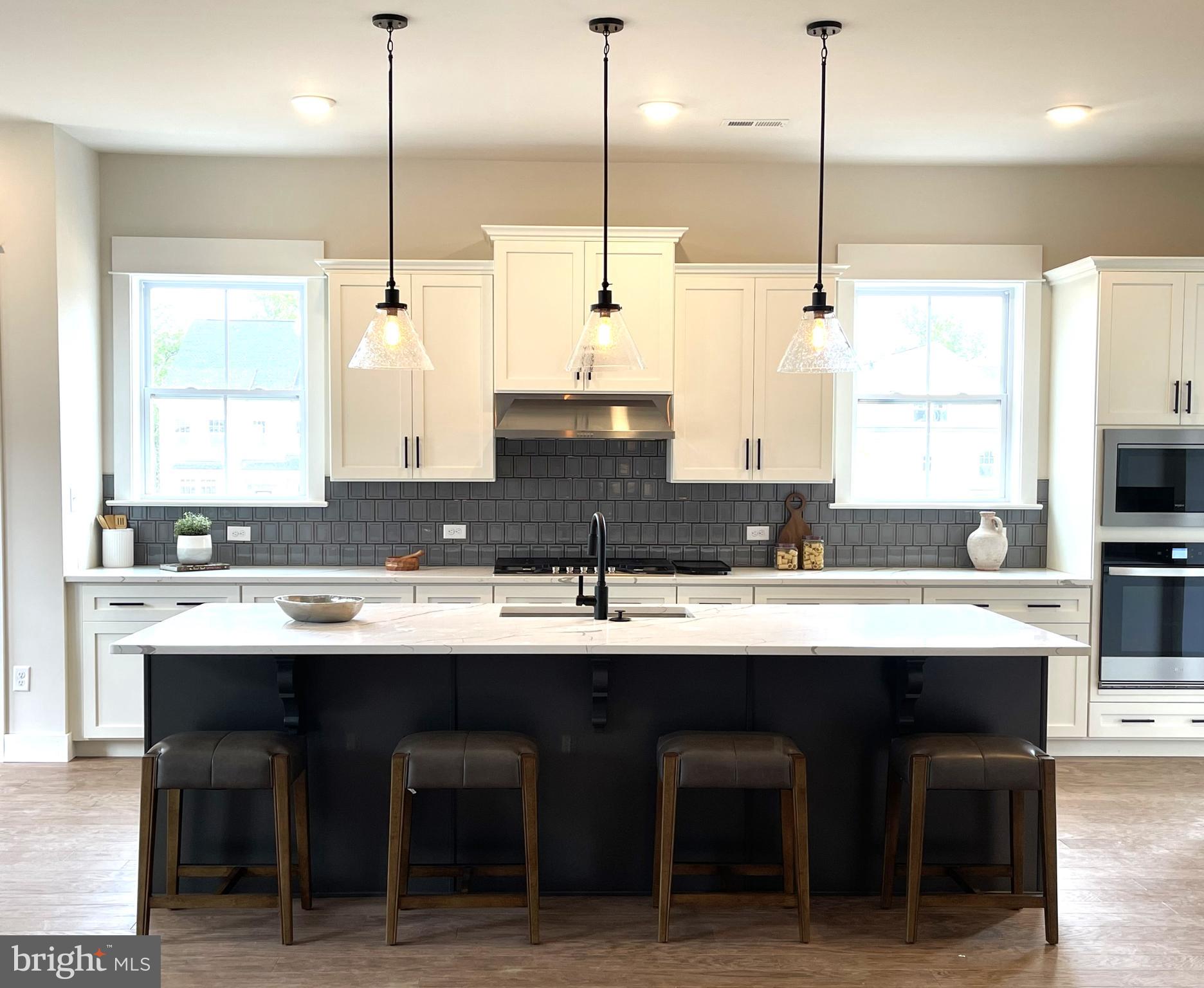 153 Lotus Lane Malvern, PA 19355 - Photo 2 of 29 a kitchen with a sink center island and cabinets
