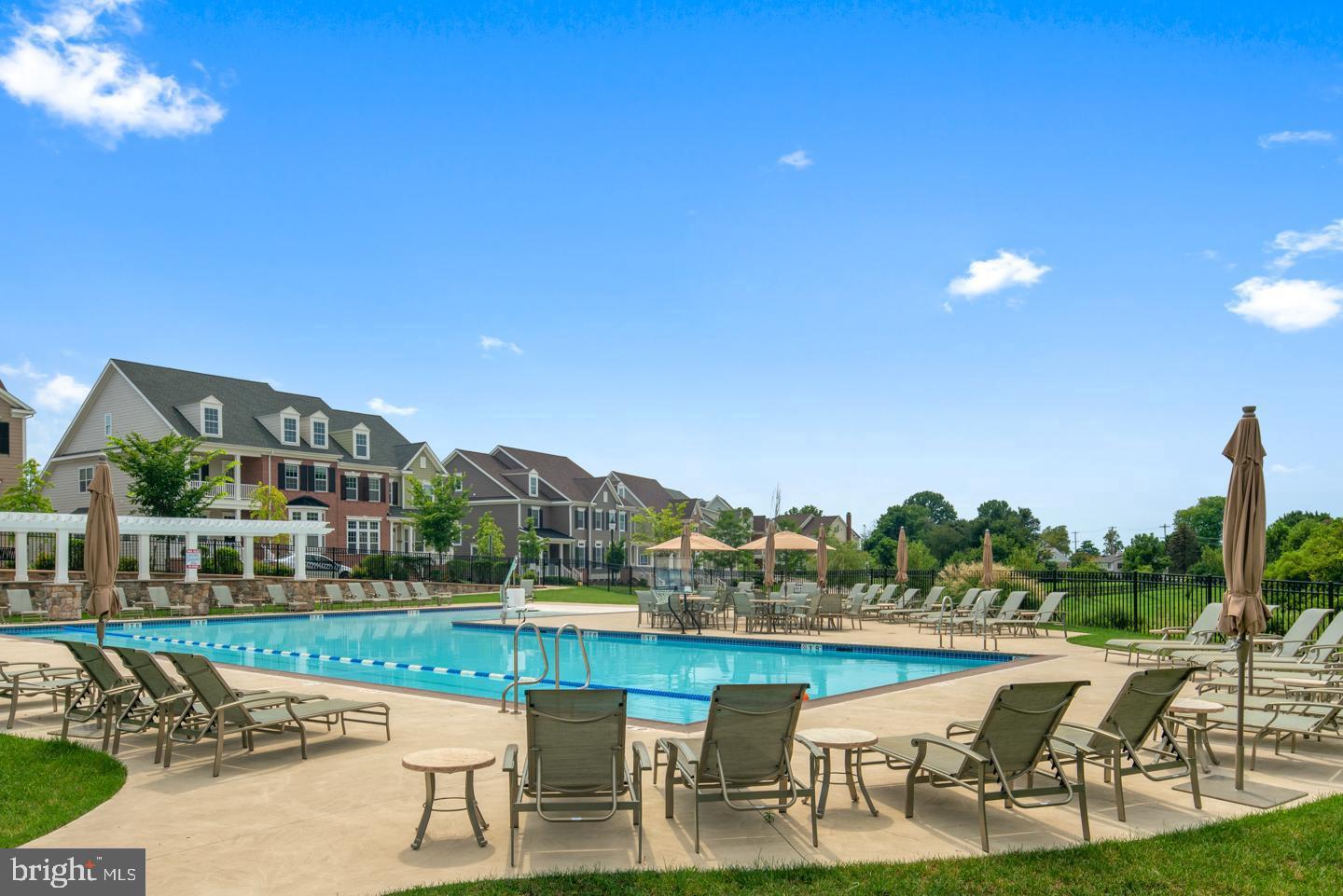 153 Lotus Lane Malvern, PA 19355 - Photo 28 of 29 a view of a swimming pool with lawn chairs and a fire pit