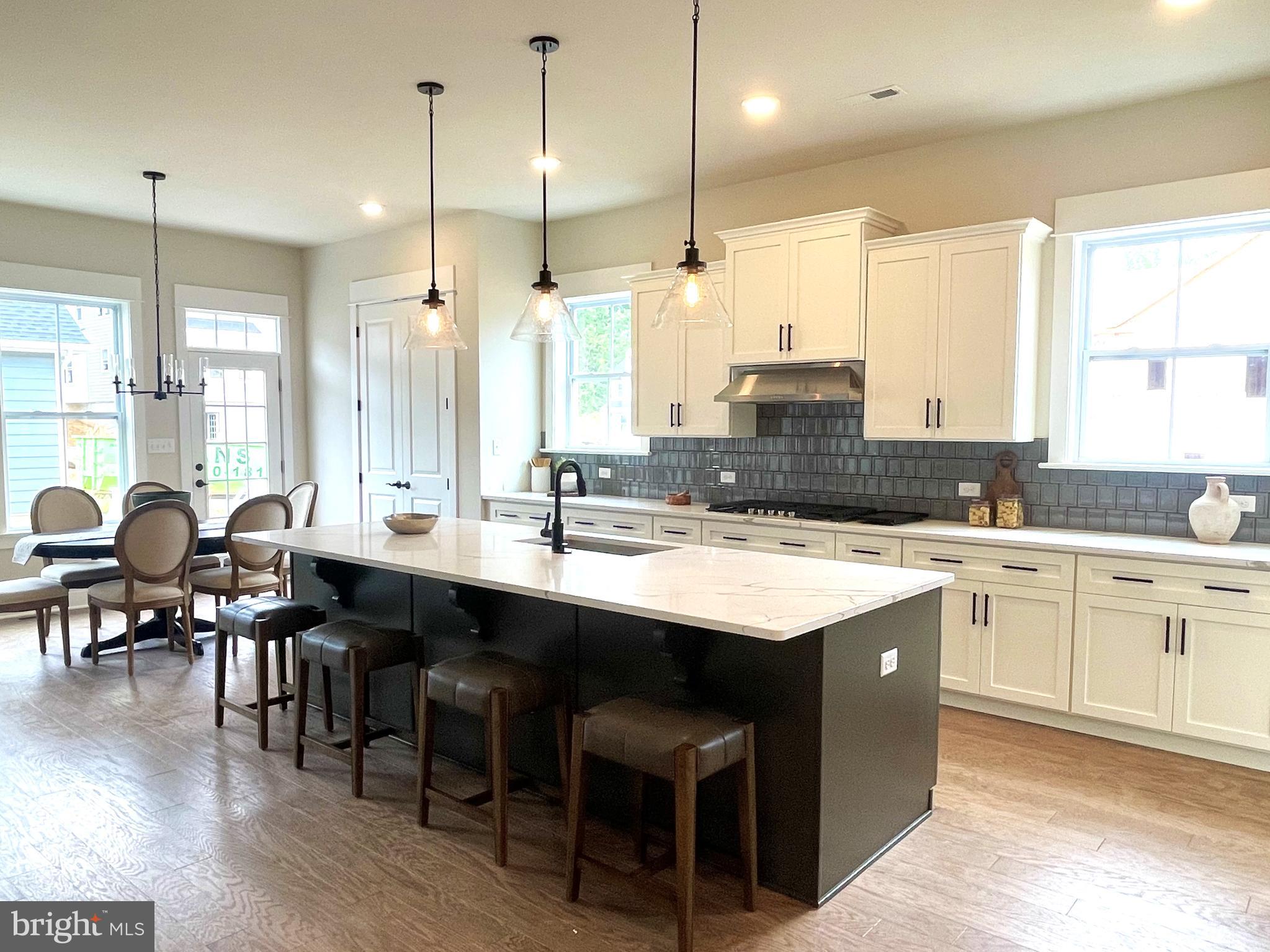 153 Lotus Lane Malvern, PA 19355 - Photo 3 of 29 a large kitchen with lots of counter space and dining table