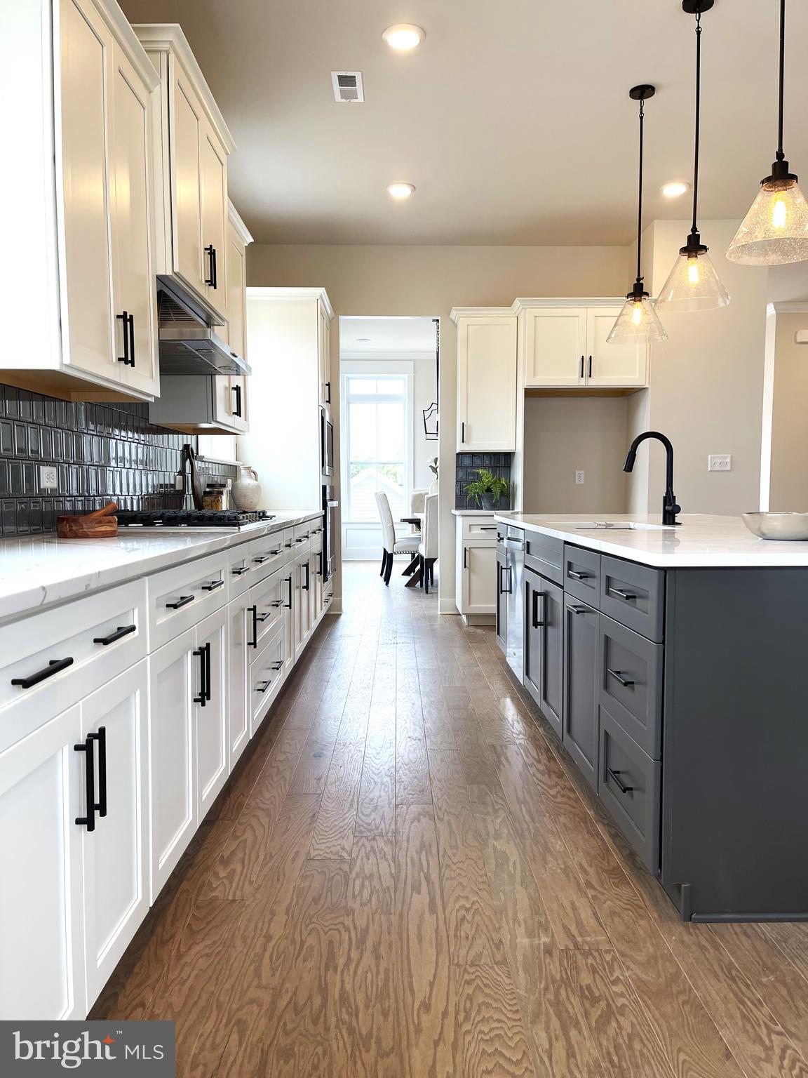 153 Lotus Lane Malvern, PA 19355 - Photo 6 of 29 a large kitchen with stainless steel appliances sink a stove and cabinets