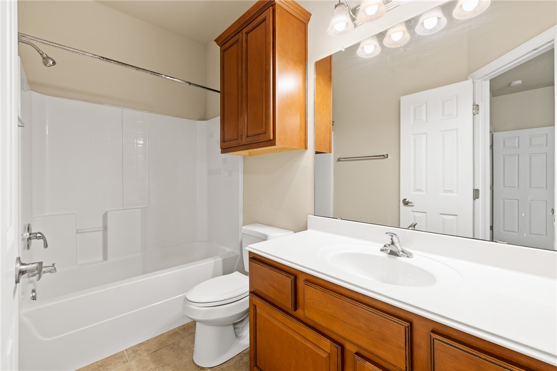 1198 Jones-Butler Road, Unit 1003 College Station, TX 77840 - Photo 14 of 42 a bathroom with a sink a toilet and shower